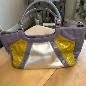 Kiki Pearl silver/La ended/chartreuse shoulder bag with magnetic close.